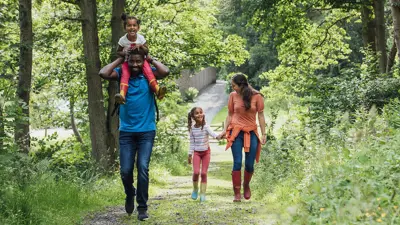 A family working through a forest