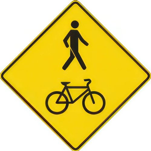 A pedestrian and bicycle crossing ahead is depicted it is a yellow road sign with a black stick figure at the top and a black bicycle underneath.