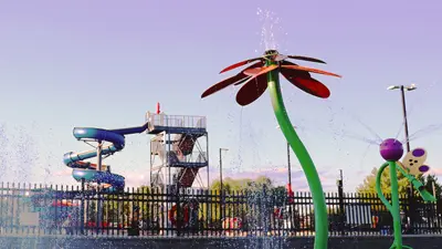 A splash pad with water features shaped like flowers.